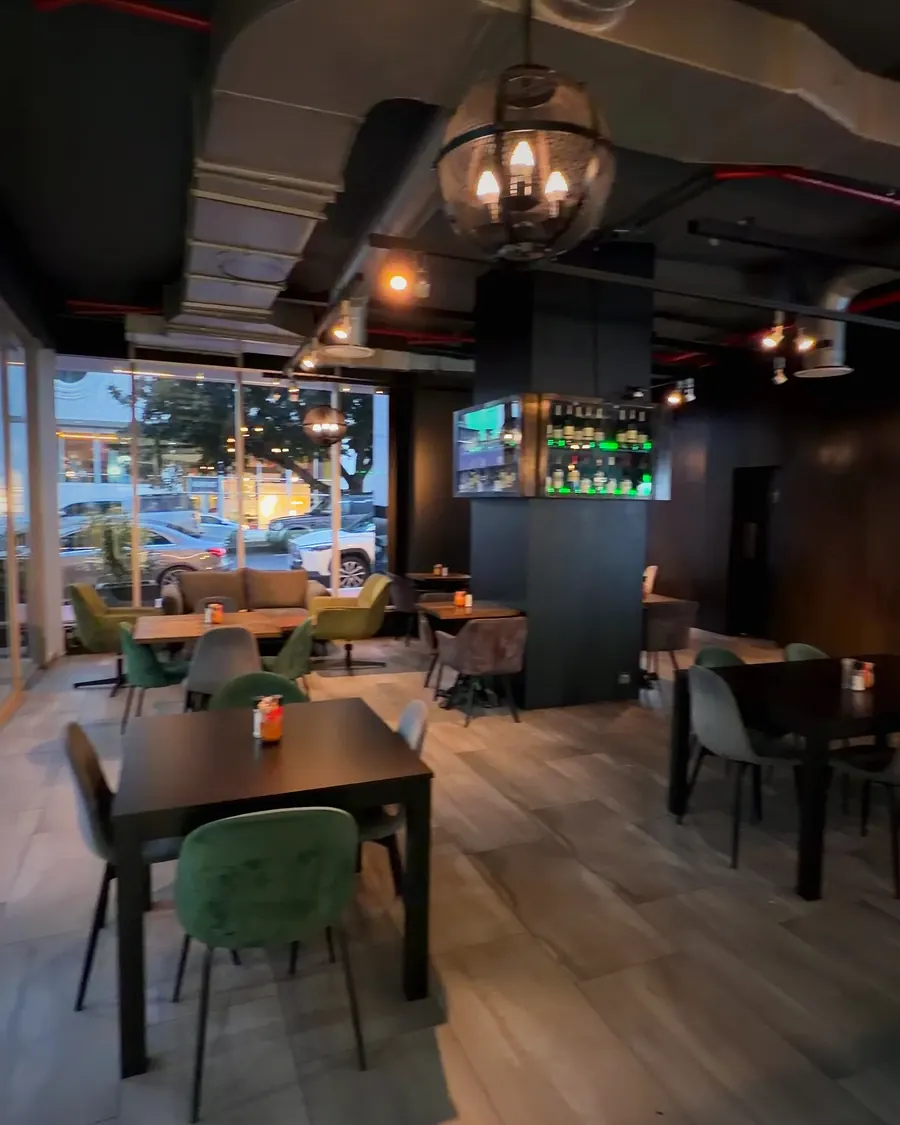 The Mulino dining room with green velvet chairs