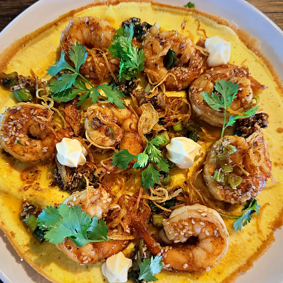 Tokyo Affair — soft omelette topped with sesame prawns, kewpie mayo and coriander